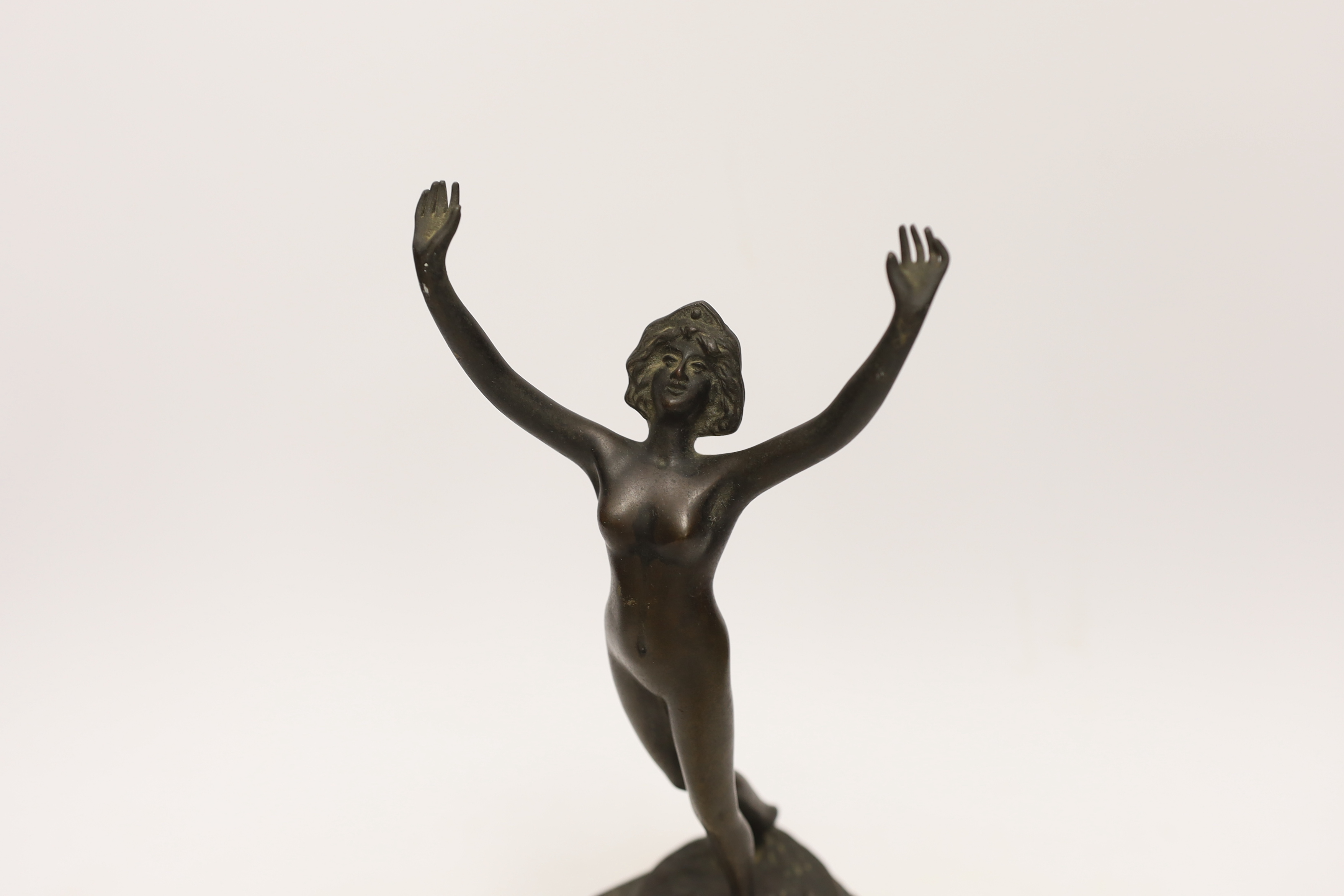 Remi Palmier (19th/20th. C), an Art Deco bronze of a nude lady, raised on square pedestal base, signed, 30cm high